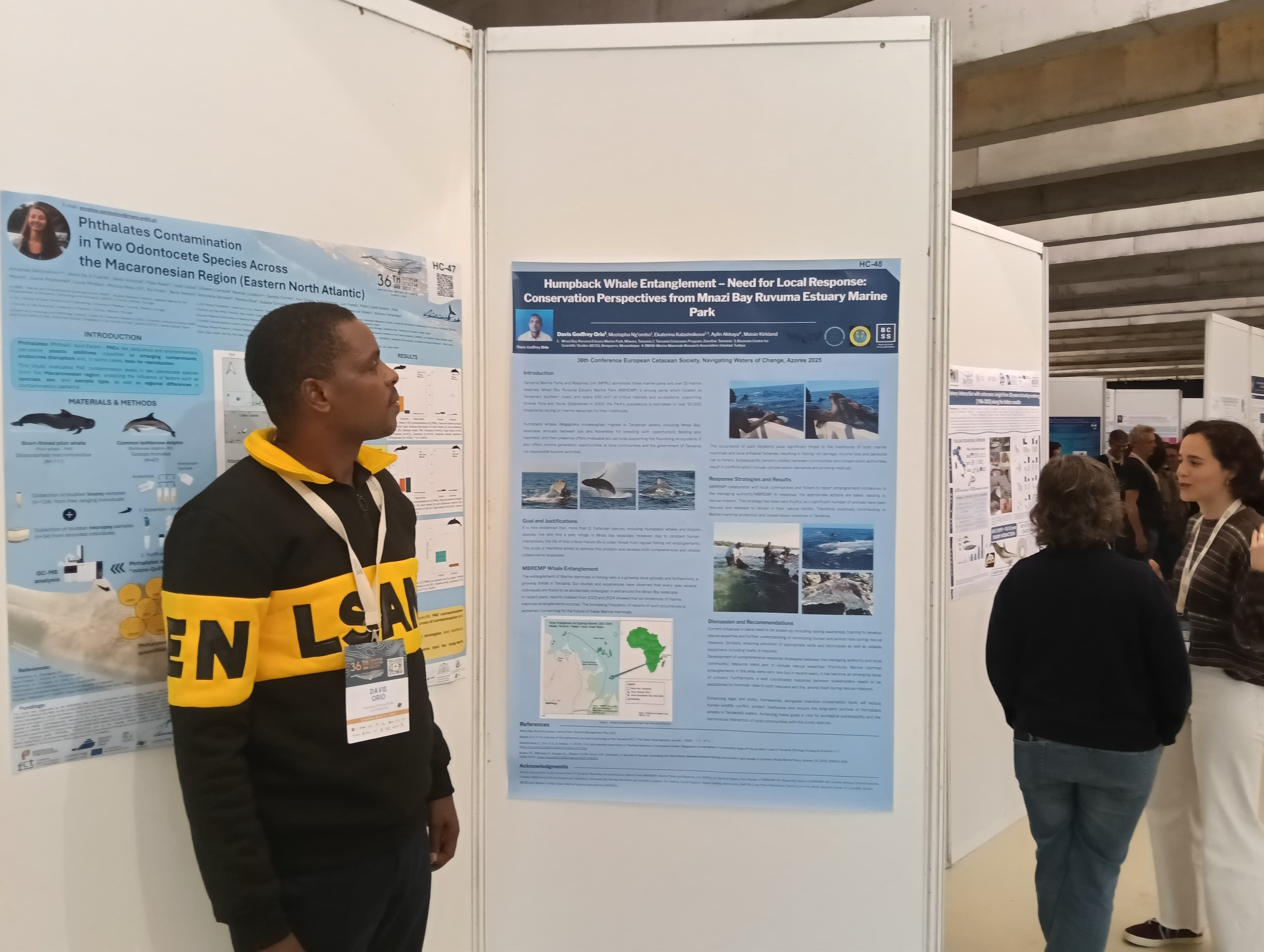 Davis Orio with poster on humpback whale entanglement ECS